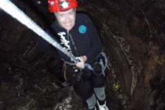 ...so she jumps into a hole in the ground...