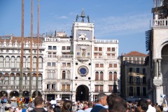 small group admires the clock